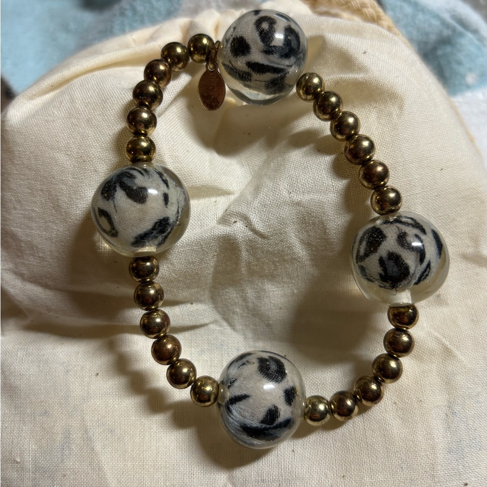 Chico’s stretch bracelet with antique gold tone and acrylic animal print beads.